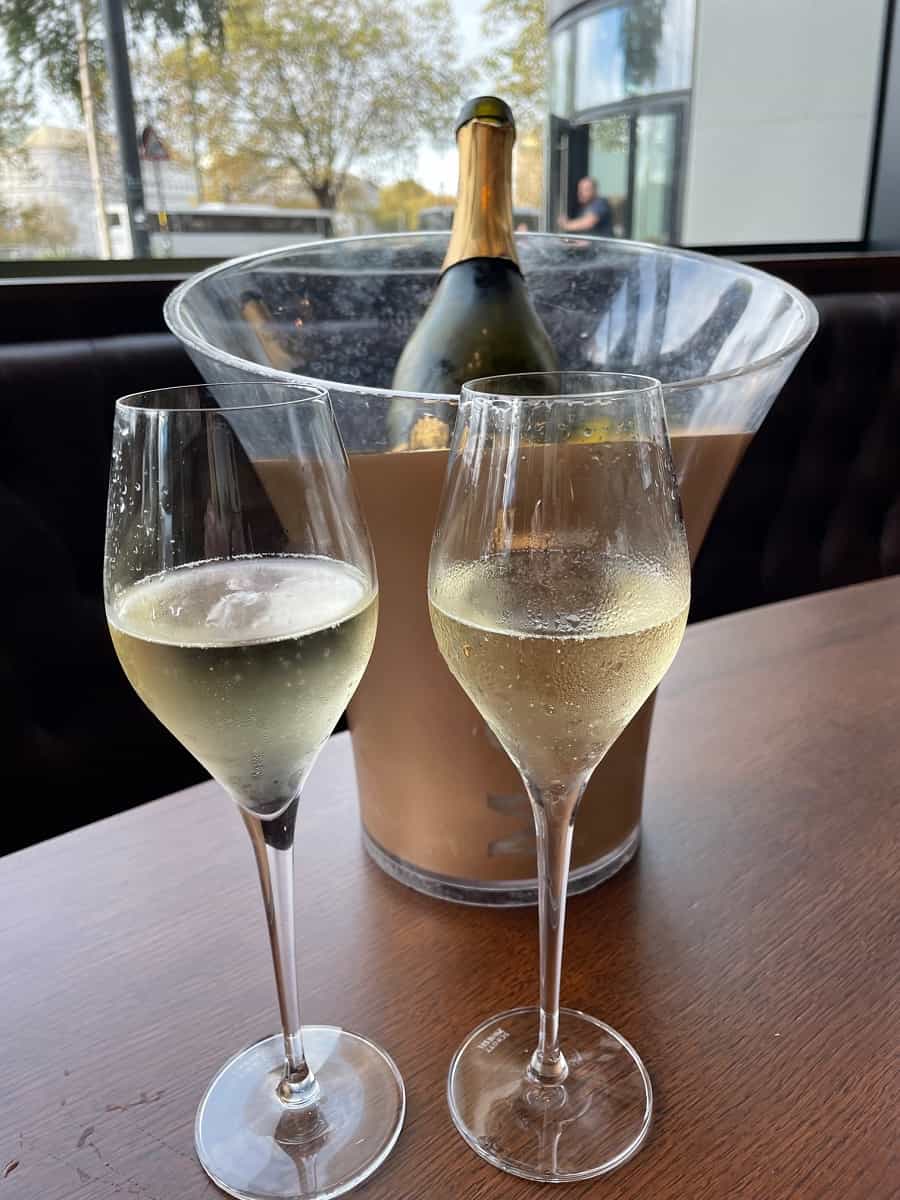 Two glasses of Prosecco with a wine bucket 